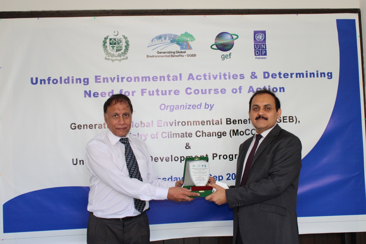 Dr. Janjua distributing awards among the speakers of the event.